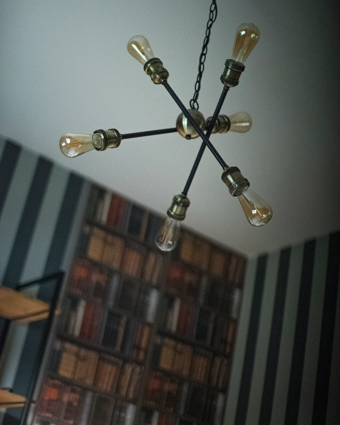 Vintage-style statement light fitting in a Hogwarts-inspired children’s study